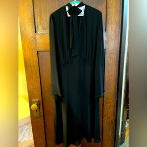 Pretty black bow tie dress with sheer sleeves and lining.